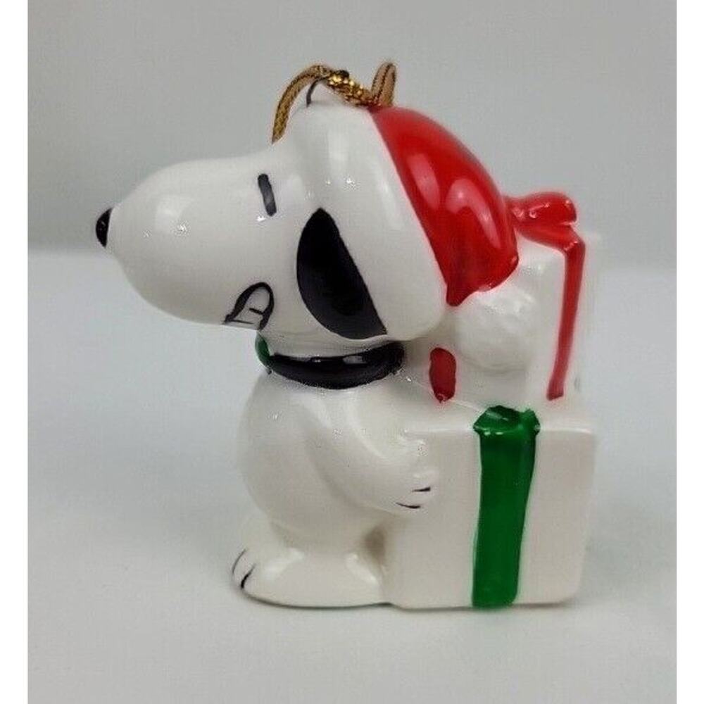 1970's Snoopy Hiding Gifts With Big Grin 3" Ceramic Ornament United Syndicate